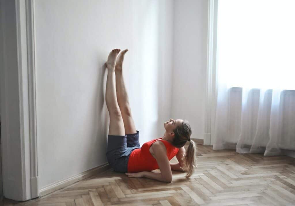 Practice Legs Up The Wall Yoga Pose (Viparita Karani) For Better Sleep!