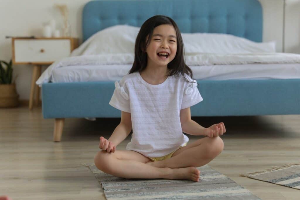 The Easy Pose (Sukhasana) is fun, easy, and one of the best yoga poses for toddlers and kids!